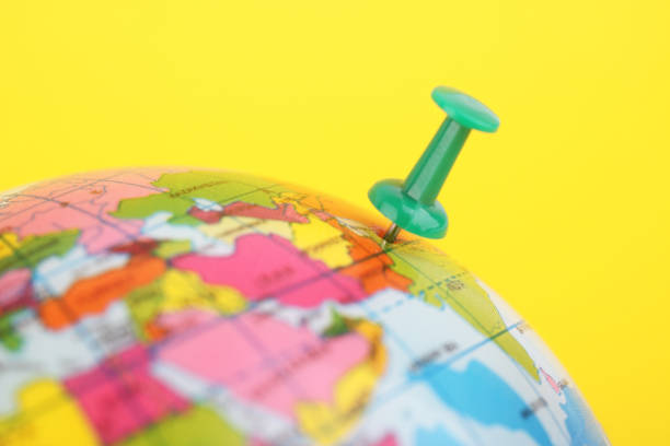 istock World globe with green pushpin ,Plan For Travelling 1288231531
