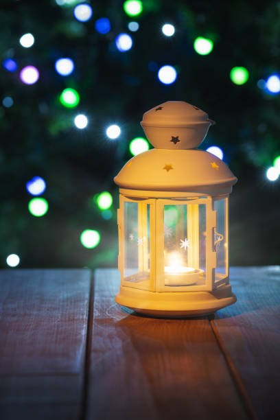 istock Christmas lantern on a wooden table with decorations. New Year card 1288234137