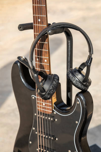 istock electric guitar and headphones 1288237227