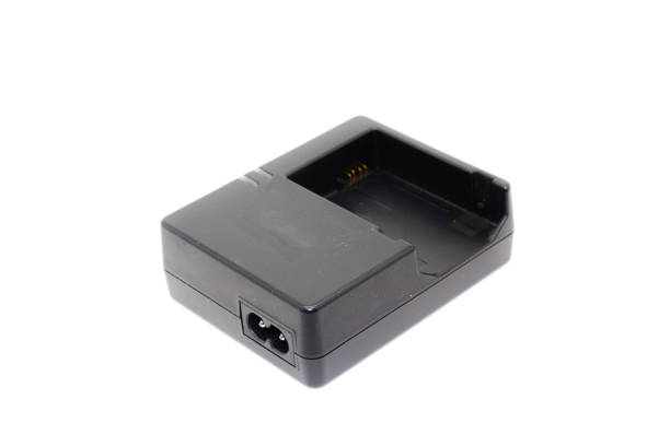 istock DSLR camera battery charger on white background 1288240224