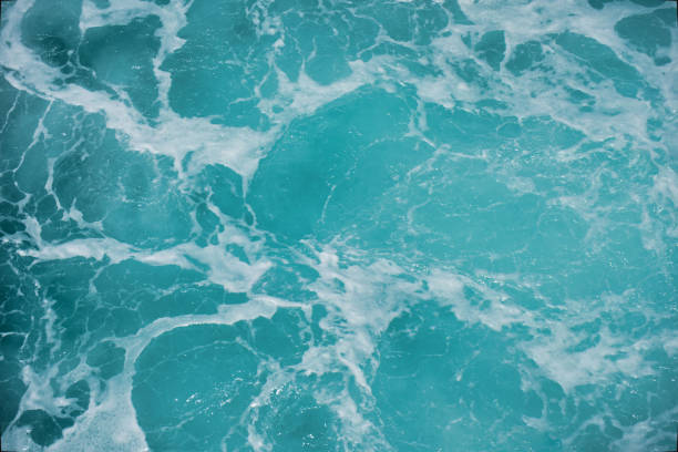 istock Abstract blue sea water with white foam for background 1288241145