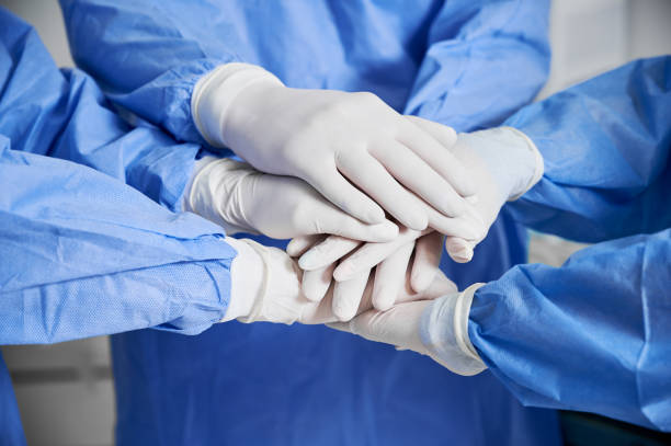 istock Medical team joining their hands together. 1288244748