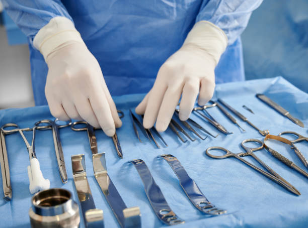 istock Doctor preparing instruments for plastic surgery in operating room. 1288244789