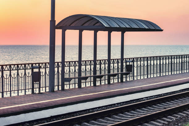 istock Passenger platform by Black sea coast at sunset. 1288245797