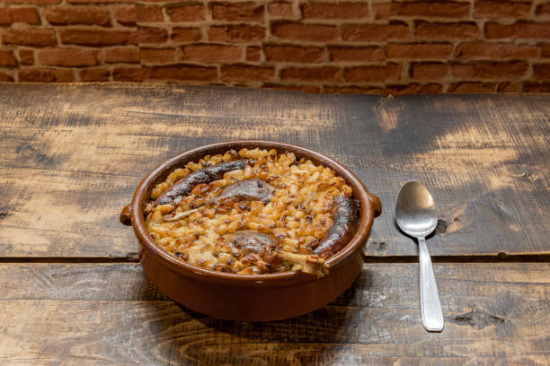 istock French specialty: cassoulet, a meal with white beans, duck leg, sausage and bacon 1288246092