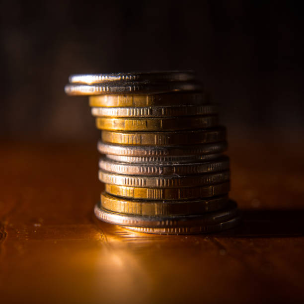 istock Coins laid out in a stack close-up, macro, space for text, background, postcard 1288248505