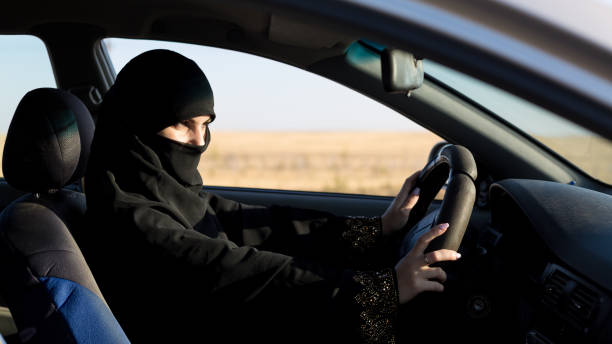 istock Serious islamic woman driver looking at road 1288248759
