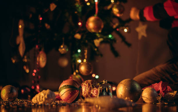 Christmas tree, ornaments and defocused lights