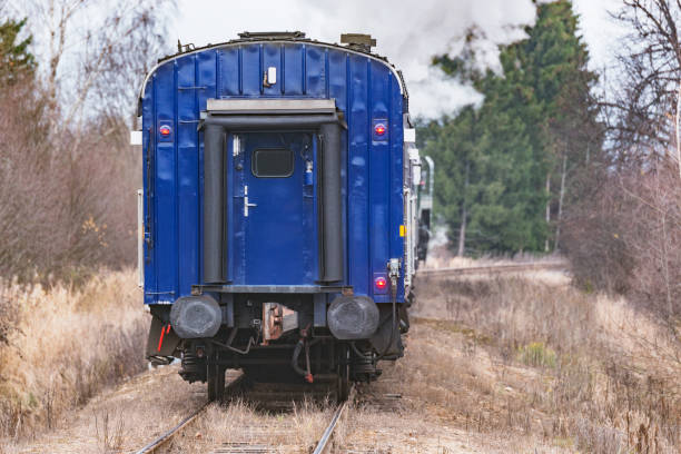 istock Steam train moves at autumn day time. 1288249591