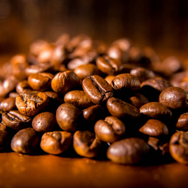 istock Roasted coffee beans on a silver background, close-up, space for text, Wallpaper, postcard, texture, background 1288249645