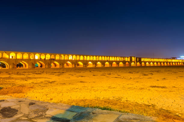 istock Arches of night view with light effect of Allahverdi Khan Bridge, also named  Si-o-seh pol bridge across the Zayanderud river in Isfahan, Iran, a famous historic building in Persian History 1288249727