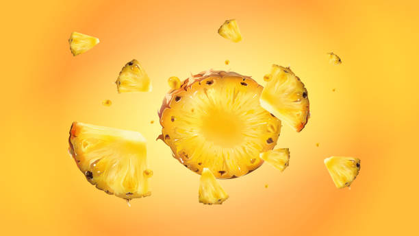 istock Slices of pineapple with droplets of juice in flight. 1288250115