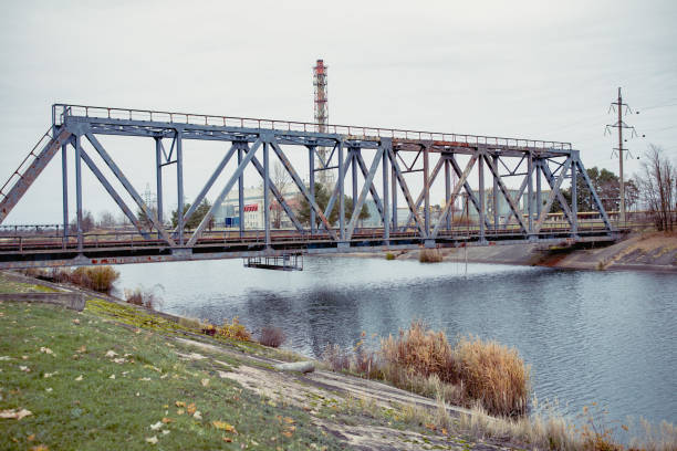 Railway bridge over the Pripyat river, Chernobyl. Metal structure, bridge supports. Bridge, years later, after the Chernobyl nuclear power plant. Ukraine 2020