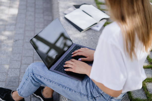 istock Adult student girl using modern laptop computer 1288253500