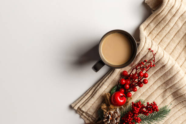 istock Abstract autumn composition. Colorful background image. Autumn, winter concept. Top view. Flat lay. Copy space. Plaid, dried leaves, cup of coffee on white background. Thanksgiving day concept 1288255581