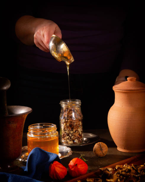 istock Cooking a delicious dessert - walnuts in honey 1288255894