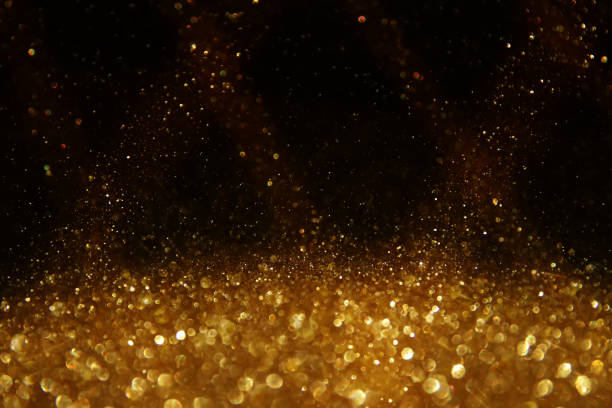 istock background of abstract glitter lights. silver, gold and black. de focused 1288257477