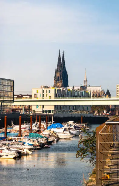 Photo of Cologne Koln, Germany: Panorama of the Rheinauhafen, Cologne Harbor, with Boats and Dom Cathedral View