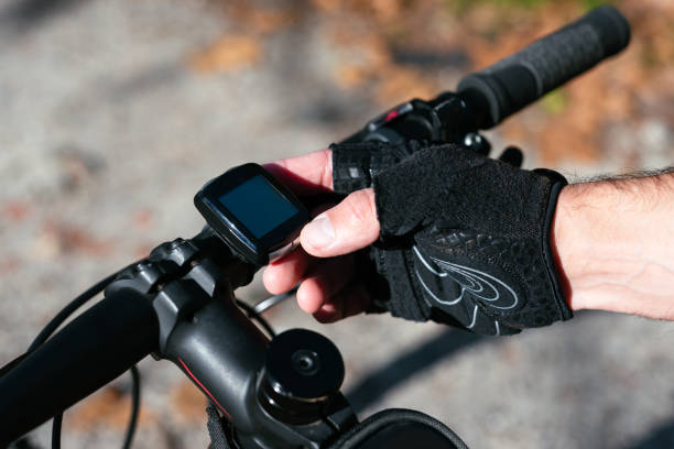 istock Close up hand using an odometer bike 1288258913