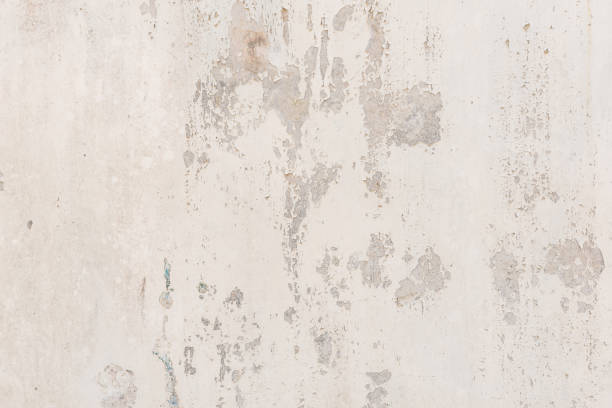 istock white white background and texture of peeling paint on plaster wall because  old paint expired. 1288259701