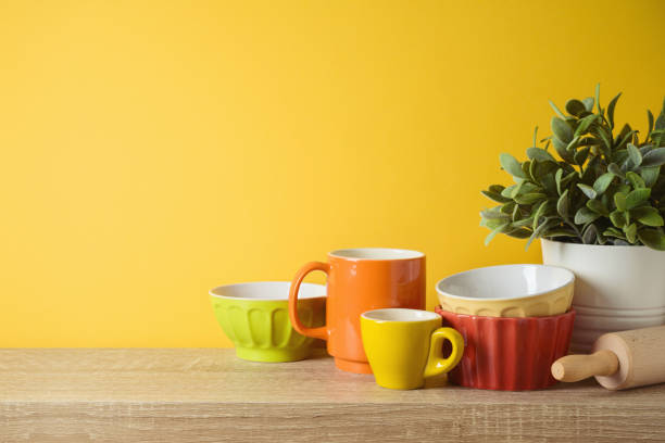istock Kitchen utensils and dishware on wooden shelf. Autumn kitchen interior background 1288260367