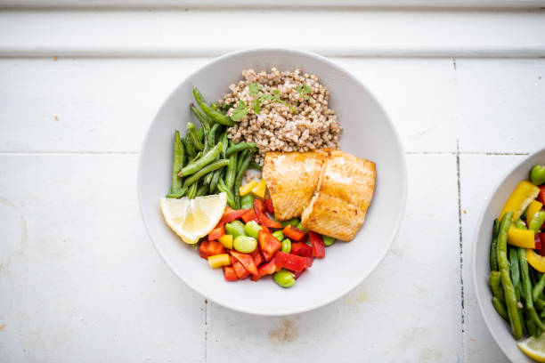 istock Salmon and buckwheat dish with green beans and tomato 1288261341