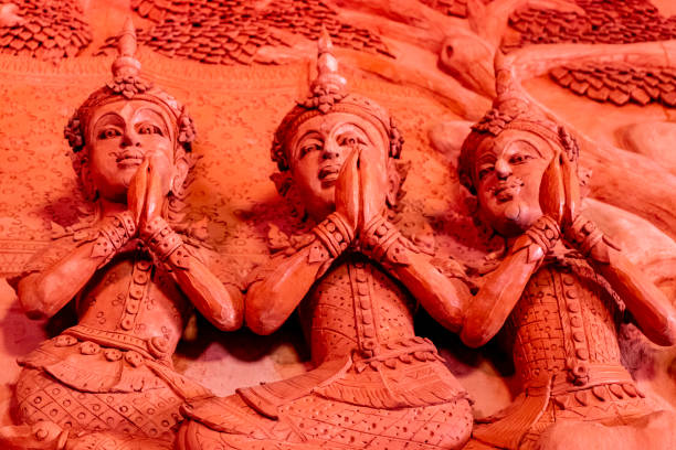 Golden Hindu god Trimurati statue be enshrined on altar. Trimurti  is the trinity of supreme divinity in Hinduism. the legend has it that those who pray there for true love will have their dreams fulfilled.
