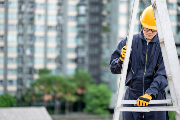 istock Male worker adjusting ladder at construction site 1288264468