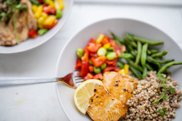 istock Salmon and buckwheat dish with green beans and tomato 1288268540