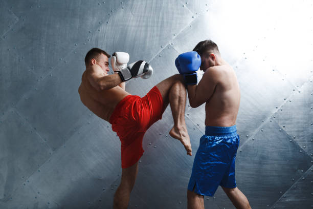 istock Two men boxers fighting muay thai boxing 1288270079