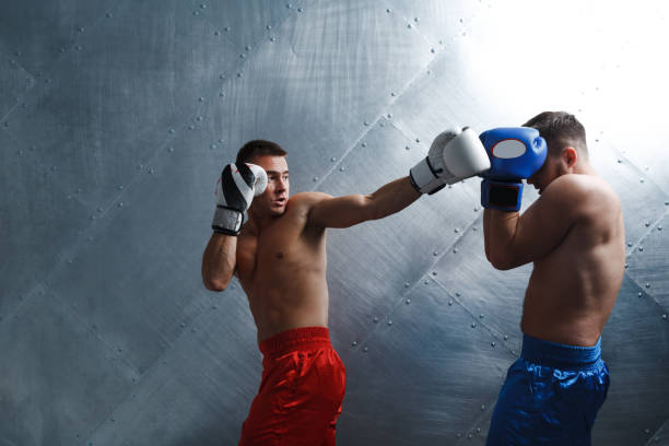istock Two men boxers fighting muay thai boxing backfist 1288270082