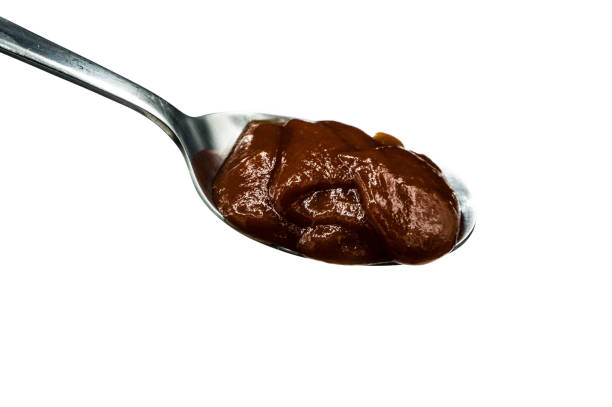 istock Ketchup on spoon isolated on a white background 1288277354