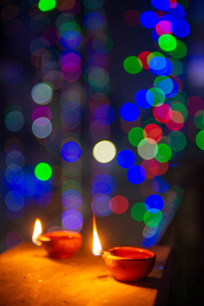 Diwali celebration with diya oil lamp with multicolor fairy lights on Diwali day.