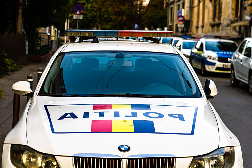Close up photography of the side signs on a Gray City Police Car in Prague Europe.
