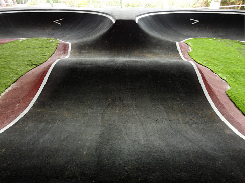 straight in a black pump track that ends in curves