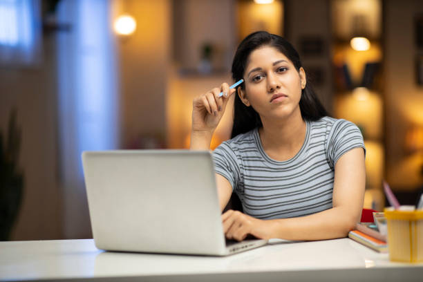 istock woman studying at home 1288282338