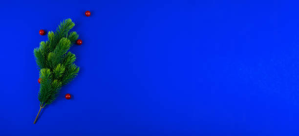 New Year and Christmas attributes and decorations on a beautiful blue background, top view, template