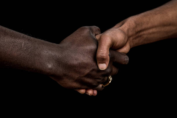 istock Close-up of handshake between two men 1288282648