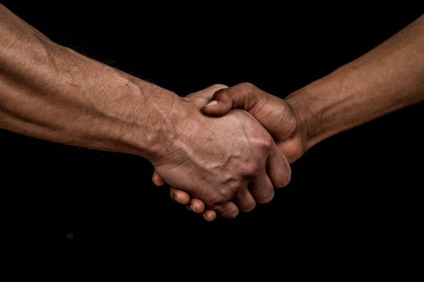 istock Hispanic and Caucasian men handshake 1288282652