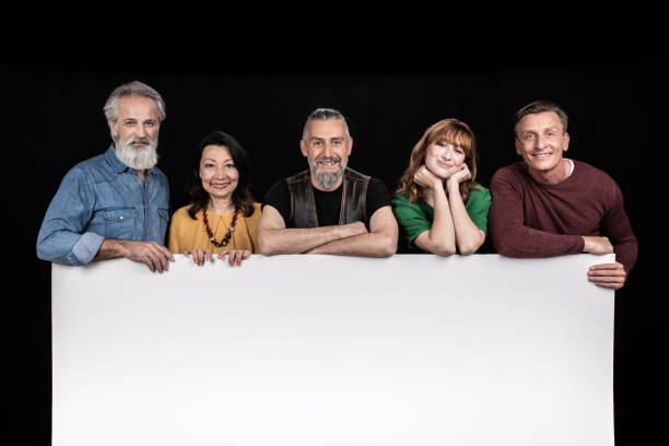 istock Men and women above blank white table for your text 1288282670