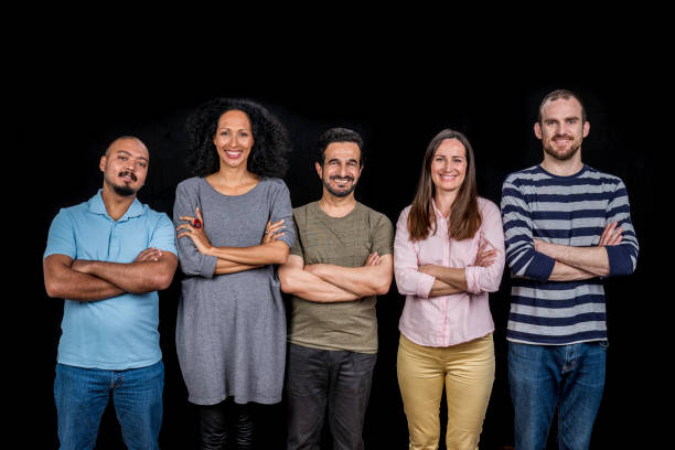 istock Happy smiling people standing with crossed arms on chest 1288282690