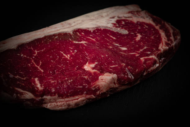 istock Raw ribeye beef steak. Texture of marble meat 1288286225