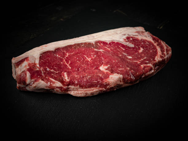 istock Raw ribeye beef steak. Texture of marble meat 1288286814