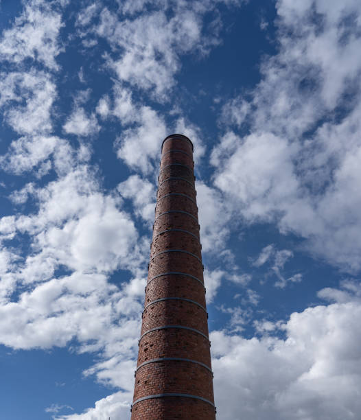 istock Tall chimney on a bright sunny day 1288291068