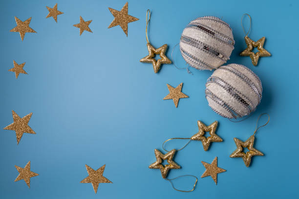 istock Festive Christmas and new year decorations on blue background 1288293006