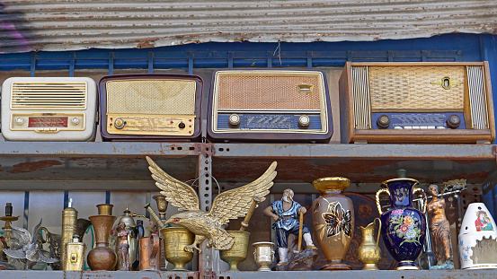Athens, Greece - May 03, 2015: Old radios and Brass antiques at Greek flea market Monastiraki.
