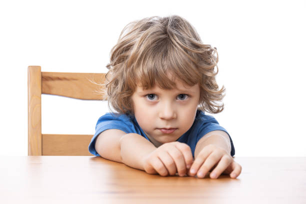 istock 4 years old happy child by the table 1288294613