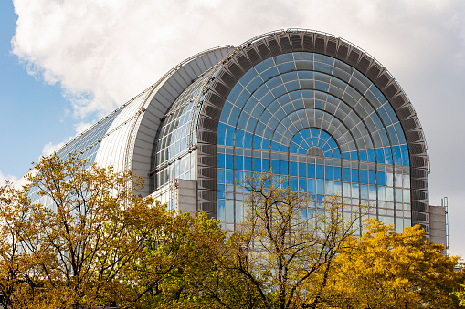 As seen from the Leopold Park in Brussels, the glass facade of the Paul Henri Spaak building of the European Parliament in Brussels. The Parliament's committee meetings are held primarily here in Brussels. The Paul-Henri Spaak building of the European Parliament was named after former President Paul-Henri Spaak. It houses the plenary sessions as well as a press centre and offices for the Parliament's president. It has a striking cylinder-shaped glass dome.