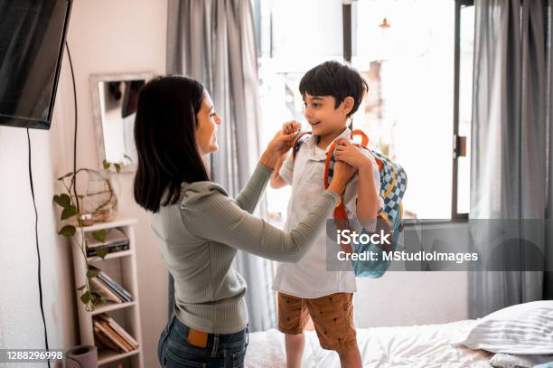 Mother And Son At Home Stock Photo - Download Image Now - Backpack, Boys, Child