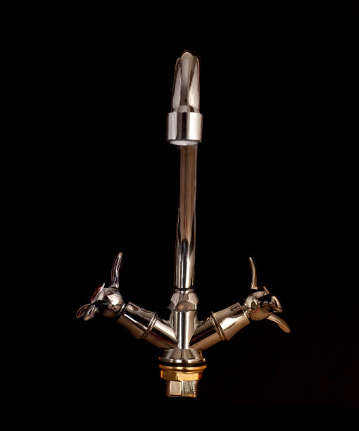 istock Modern kitchen faucet isolated on black background 1288303805